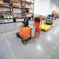 Autonomous_warehouse_vehicles_Toyota_Tugger_with_cart