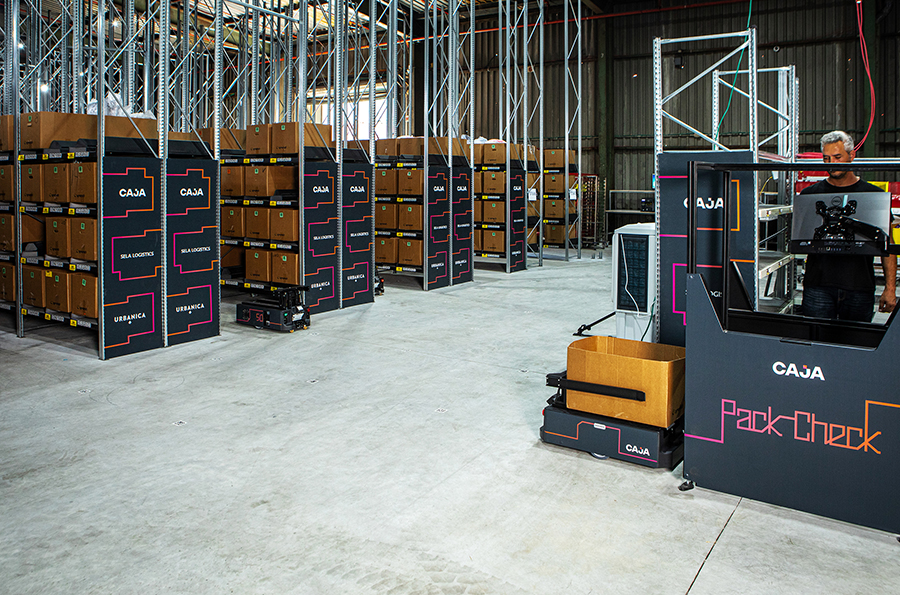 Caja-Robotics-Goods-to-Person-AMR-ASRS-order-fulfillment-cart-robot-at-packcheck-workstation