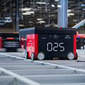 Hercules-AutoStore-redline-robots-on-AutoStore-grid-goods-to-person-automated-storage-system-thumb