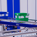 Hercules-color-coded-bins-traveling-on-bastians-solutions-roller-conveyor-thumb