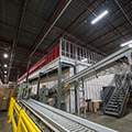 Richelieu-DC-automation-goods-to-person-AutoStore-conveyor-side-view-thumb