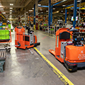 warehouse-AGV-Toyota-AGF-Group-Shot-5-automated-fork-truck-center-controlled-rider-tugger-thumb